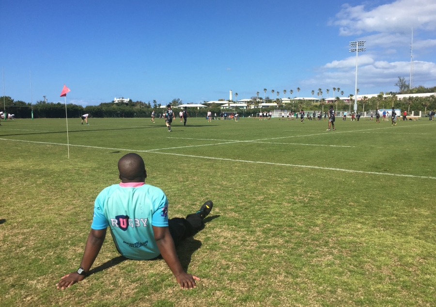 referee sits to watch the ongoing rugby event